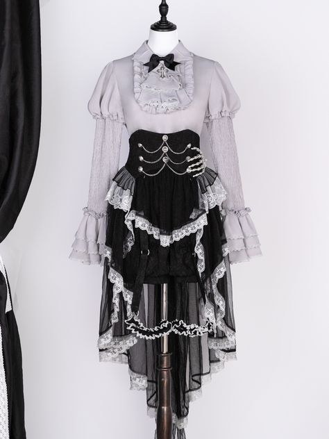 This blouse features a unique bat-shaped collar that adds a touch of mystique to your ensemble. Skirt designed with multiple layers of delicate tulle, offerring a voluminous silhouette that sways with every step. The high waist design accentuates your figure, crafted with intricate detailing, this headpiece features a skeletal hand design that sits elegantly atop your head.  Perfect for gothic, lolita, or Halloween-themed outfits, it adds a unique and spooky flair to your look.  Blouse Dark Styles Outfits, Spooky Halloween Outfits, Devilinspired Outfit, Halloween Theme Outfits, Gothic Skirt Outfit, Cute Gothic Outfits, Bat Outfit, Bat Collar, Outfit Themes