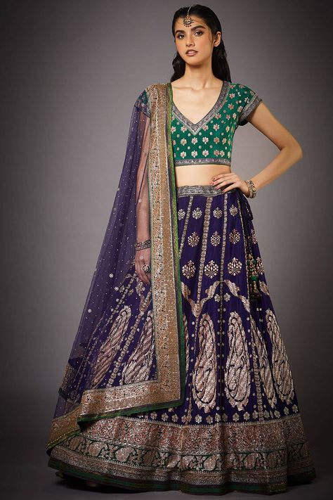 Featuring a purple and emerald green lehenga in silk chinon base. It is paired with a matching blouse and a dupatta.  FIT: Fitted at bust and waist.  COMPOSITION: Silk chinon. CARE: Dry clean only. Green And Blue Lehenga, Emerald Green Lehenga, Blouse With Skirt, New Lehenga, Purple Lehenga, Emerald Green Blouse, Beef Empanadas, Emerald Green Weddings, Ritu Kumar