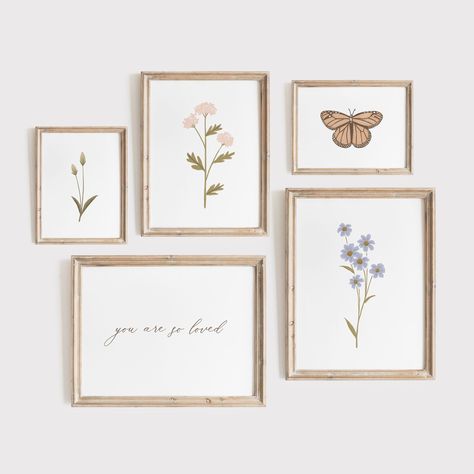 THIS ITEM IS A DIGITAL DOWNLOAD Please note that this listing is for digital files only. No physical product will be shipped. ABOUT Add the perfect finishing touch to your little one's nursery or bedroom decor with this set of vintage wildflower prints. This set includes two wildflower prints, one greenery, one butterfly, and one 'you are so loved' print. With multiple sizes to choose from, these files are designed to fit almost any frame size. Download, print, and trim your art at home within m Muted Floral Nursery, Nursery Wall Art Collage, Wildflower Room Theme, Floral And Butterfly Nursery, Butterfly Nursery Art, Wildflower Themed Nursery, Wildflower Nursery Decor, Wild Flower Nursery Theme, Vintage Floral Nursery Decor