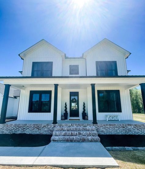 Black Brick Porch White House, Front Porch With Black Posts, White House With Black Pillars, Black Columns Front Porch Brick House, White House With Black Brick Foundation, Colorful Front Door White House, White And Black Front Porch, Black Porch Columns Brick House, Black Front Porch Posts