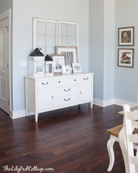 Coastal Dark Floors, Light Blue Foyer, Pale Blue Walls Living Room, Light Blue Walls Kitchen, Bm Brittany Blue, Pale Blue Living Room Walls, Benjamin Moore Brittany Blue, Blue Walls Dark Floors, Light Blue Living Room Walls