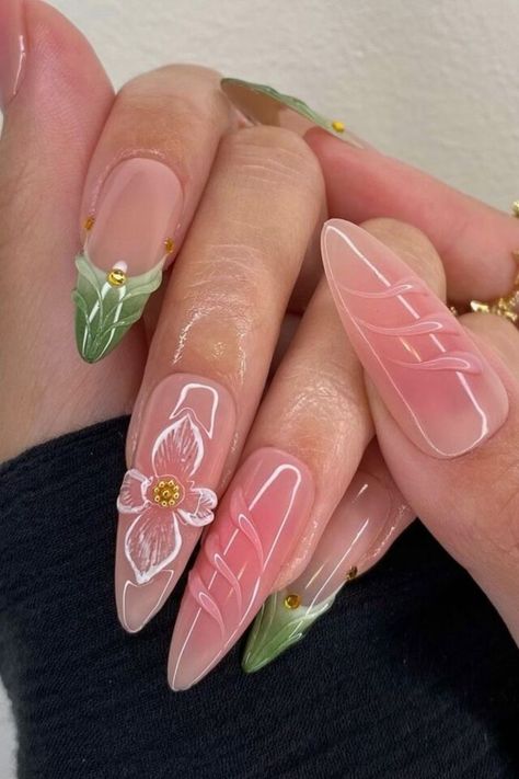 The hues of nude pink and natural green convey innocence and kindness. It’s cute how each nail is unique, with appealing flower and grass features. With a floral light dress and these nails, you’ll seem like a spring princess. //photocredit: @clawsxcollxtion Light Purple Summer Nails, Light Pink And Green Nails, Light Pink Nails With Design, Green Pink Nails, Fairy Nails, Simple Spring Nails, Light Pink Nails, Pink Ombre Nails, Green Nail Designs