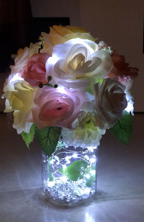 Fairy Lights In Flower Vase, Flower Bouquet With Led Lights, Mason Jar Fairy Light Wedding Centerpieces, Mason Jar Fairy Lights Centerpiece Wedding Decorations, Mason Jar With Fairy Lights And Flowers, Spring Flower Arrangements Centerpieces, Tin Flowers, Spring Flower Arrangements, Vase With Lights