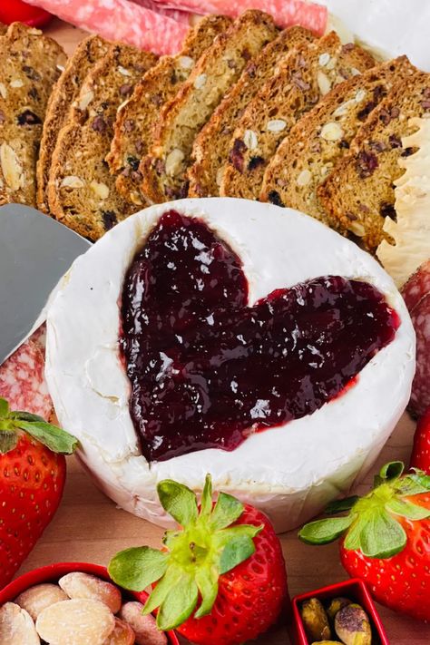 Love is in the air with this Brie-Filled Heart Charcuterie Board. Gather jam, a wheel of Brie, and your favorite Valentine’s Day treats! Valentines Baked Brie, Heart Charcuterie Board Ideas, Heart Shaped Charcuterie Board, Valentine Charcuterie Board Ideas, Valentine Charcuterie Board, Valentines Day Charcuterie Board, Heart Charcuterie Board, Galentines Event, Valentines Charcuterie Board