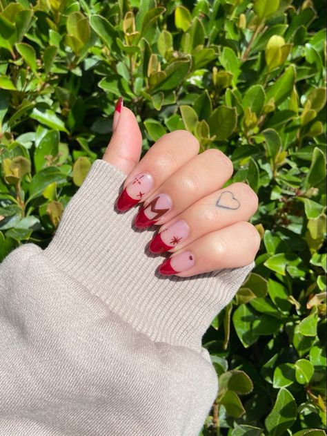 Scarlet witch/ Wanda Maximoff nails. Red French tip nails with stars and Wanda logo Wanda Inspired Nails, Wanda Maximoff Inspired Nails, Disney Marvel Nails, Scarlet Nails Design, Avengers Nails Designs, Iron Man Nails Designs, Marvel Avengers Nails, Marvel Nails Short, Scarlett Witch Nails