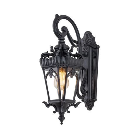 Blending traditional style in a classic design with this outdoor wall light. Inspired in castle, the lantern features an exquisite design with detailing in a classic matte black finish, descends from elaborate, sweeping swirls and curves. Angled, beveled clear tempered glass complements the gracefulness of the curvatures. The lantern hangs from a decorative scroll arm and is firmly affixed to the matching wall plate. Made from aluminum, this wall light ensures long-lasting durability and resista Exterior Light Fixtures, Black Outdoor Wall Lights, Black Light Fixture, Dark Home Decor, Goth Home Decor, Outdoor Wall Lantern, Gothic Home Decor, Porch Lighting, Wall Lantern