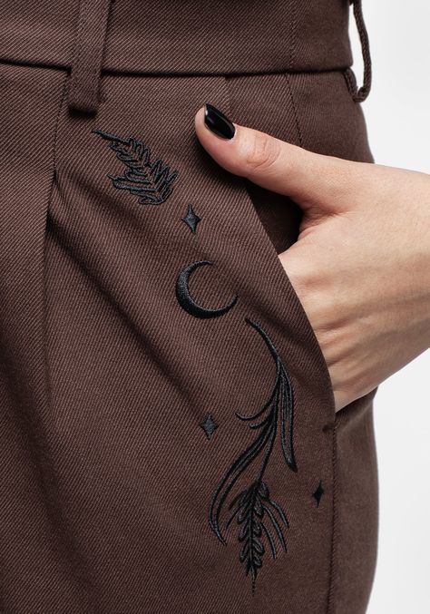 - Brown embroidered balloon-leg trousers - High-rise fit with roomy balloon legs & turned-up cuffs - Button & zipper fastening with belt loops for secure fastening & easy accessorising - Elasticated back waistband for comfort & breathability - Two functional front pockets & two back welt pockets - Rich brown woven twill with black leafy moon embroidery 78% polyester, 20% viscose, 2% elastane Alisa is 5'5" and wearing a size UK8 Balloon Trousers, Embroidery On Clothes, Embroidered Clothes, Printed Denim, Embroidery Inspiration, Embroidery And Stitching, Embroidery Projects, Embroidery Art, Cloth Bags