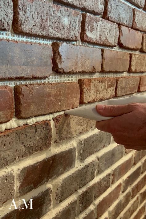 Bricks Backsplash Kitchen, Brick Floor Grout Color, Grout Colors For Brick, Re Grouting Brick Fireplace, Brick Veneer Accent Wall, Grouting Brick Backsplash, Brick In Bathroom Accent Walls, Brick Wall Exterior Ideas, Brick Tile Accent Wall