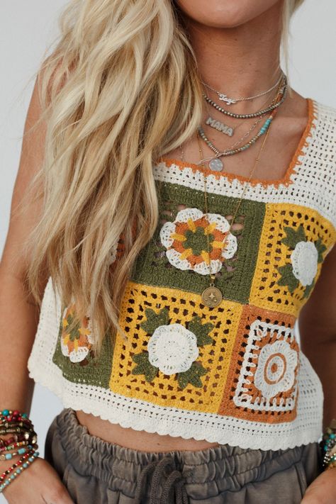 You'll add a touch of nostalgic charm to every outfit with our Fair And Square Crochet Top -a unique and eye-catching look that's perfect for warm weather days or festival season! You'll love adding a bohemian twist to your everyday style in this top because it features: Comfortable and cute crochet fabric with colorful square details Relaxed and loose, cropped length silhouette Classic square neckline with thick tank straps So cute crochet flower details throughout Scalloped edges along the nec Crochet And Sewing Combined, Granny Square Top Crochet, Colorful Crochet Top, Cute Crochet Tops, Boho Essentials, Bohemian Twist, Floral Mosaic, Padded Bralette, Crochet Fabric