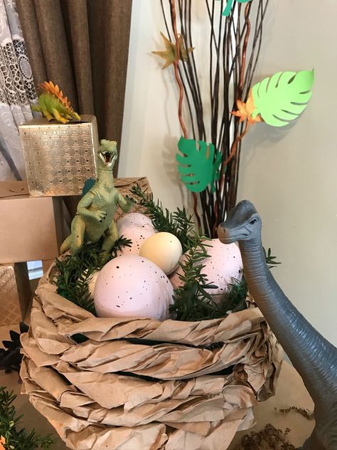 Dinosaur nest decor Dinosaur Egg Decor, Dinosaur Themed Decorations, Dinosaur Decorating Ideas, Dinasour Decorations, Dinosaur Props Diy, Dino Theme Party Decor, Jurassic Park Decoration, Jurassic Park Classroom Door, Dinosaur Halloween Decorations