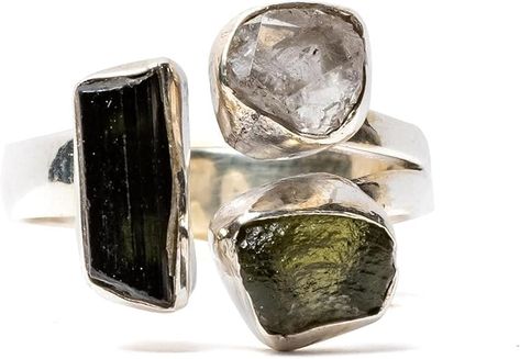 PRICES MAY VARY. Genuine Moldavite: Crafted with authentic Moldavite, a rare green gemstone formed from meteorite impact, ensuring uniqueness and mystique. Sterling Silver Band: Features a high-quality sterling silver band, providing durability and elegance to complement the striking Moldavite stone. Handcrafted Design: Each ring is meticulously handcrafted by skilled artisans, guaranteeing attention to detail and a one-of-a-kind piece. Healing Properties: Believed to possess powerful metaphysic Moldavite Ring, Herkimer Diamond Ring, Moldavite Stone, Silver Handmade Jewelry, Sterling Silver Jewelry Handmade, Rare Gemstones, Christmas Gift Jewelry, Green Gemstones, Herkimer Diamond