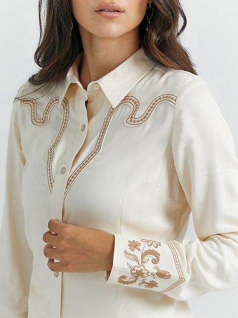 You’ll feel as though you’ve traveled through time from the glory days of Western wear every time you wear our Women’s Embroidered Rodeo Snap Shirt. This heritage-inspired shirt is crafted from rayon twill for a light and airy feel all year round. It features a pointed yoke in the back and an intricate yoke in the front with Western-inspired stitching, as well as floral embroidery at the cuffs and pearl snaps for authenticity. Fancy Embroidery, Boys Cowboy Boots, Horse Show Clothes, Girl Cowboy Boots, Twisted X Boots, 60s 70s Fashion, Rodeo Shirts, White Shirts Women, Vintage Vibe