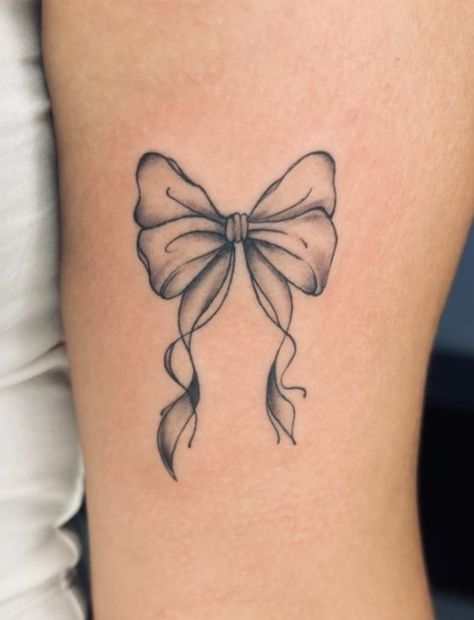 Pretty Bow Tattoo, Bow On Hip Tattoo, Vintage Bow Tattoo, Bow Tattoo On Thigh, Flower With Bow Tattoo, Bow Ankle Tattoo, Back Of Thigh Bow Tattoo, Bow Tattoo Meaning, Bow Lower Back Tattoo