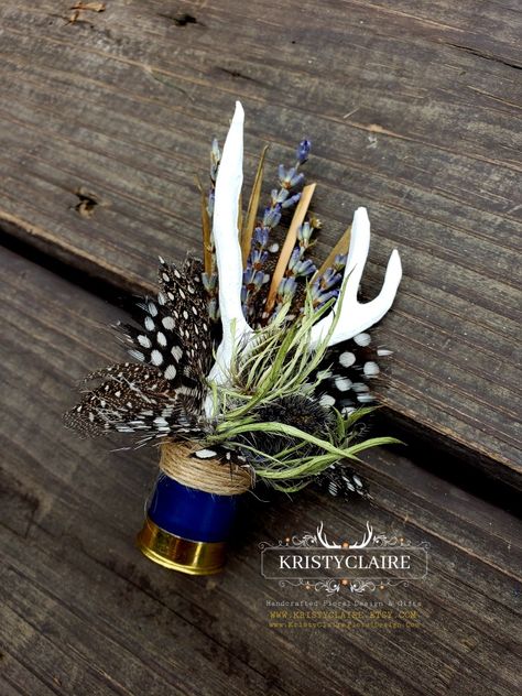 Custom Half Navy Blue Shotgun Shell Boutonnieres with Antlers, Lavender, Guinea Hen Feathers & Thistle 💙
WWW.KRISTYCLAIRE.ETSY.COM 
www.kristyclairefloraldesign.com 
#weddingboutonniere #weddingdecor #wedding #weddingcorsage #weddingparty #weddingdesign #newzealand #shotgun #shotgunshells #antlers #antlerdecor #antlerart #hunting #unique #lavender #thistle #polkadots #guineafowl #newzealandlife #newzealandphotography #thankyou #fauxantlers #mini Fishhook Boutonniere, Shotgun Boutineers, Western Wedding Boutonniere, Hunting Boutonniere, Shotgun Shell Boutineer, Shotgun Shell Boutonniere Diy, Antler Themed Wedding, Antler Boutonniere, Fishing Boutonniere