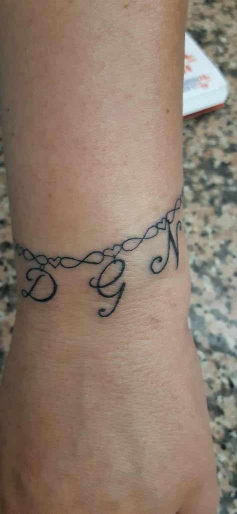 Tattoo Ankle Bracelet With Names, Ankle Tattoo With Names, Initial Anklet Tattoo, Ankle Bracelet Tattoo With Initials, Initial Bracelet Tattoo, Charm Tattoo Bracelet, Charm Bracelet Tattoo With Names, Bracelet Tattoo With Initials, Anklet Tattoos For Women Chains