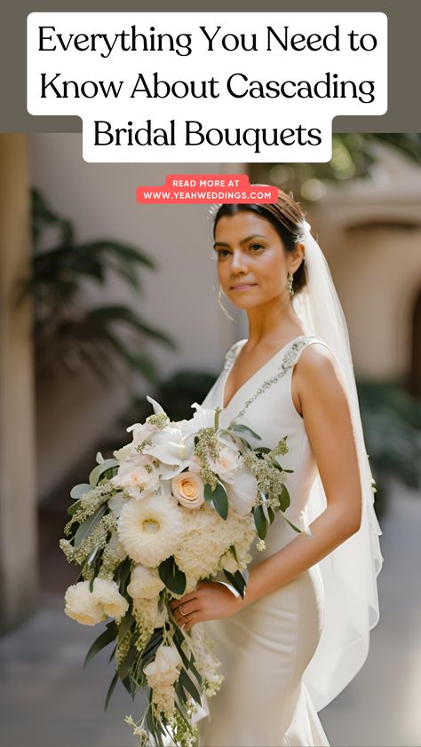 A stunning bride holding a cascading bridal bouquet, featuring elegant flowers that flow beautifully, perfect for matching her dress and wedding theme. Spring Cascading Wedding Bouquets, Diy Cascading Wedding Bouquet, Cascading Table Arrangement, Red Cascade Bridal Bouquet, Wedding Bouquets Shapes, How To Make A Cascading Bouquet, Cascading Bride Bouquets, Blue And White Cascading Bridal Bouquet, Small Cascading Wedding Bouquets