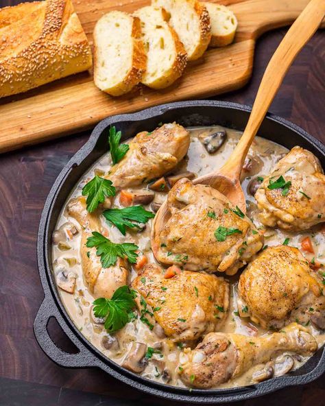 Chicken Fricassee is a hearty stew made with chicken pieces that are seared and then braised in a silky white wine-cream sauce with carrots, celery, onion, and mushrooms. This comforting dish is great with crusty bread or mashed potatoes and perfect for cooler weather! #chickenfricassee #fricassee #chickenstew #chickenrecipes White Wine Cream Sauce, Sip And Feast, Oyster Stew, Chicken Fricassee, Hearty Stew, Carrots Celery, Chicken Cacciatore, Chicken Pieces, Ginger Chicken