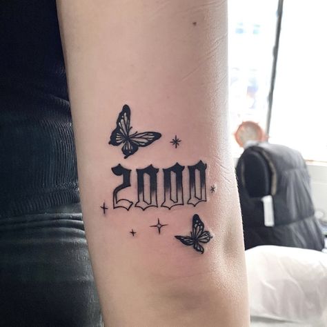 Birth Year Tattoo With Butterfly, Butterfly With Year Tattoos, 2005 Butterfly Tattoo, Birth Year Tattoo Ideas Ankle With Butterfly, Year Tattoo Number With Butterfly, 2000 Knee Tattoo, 1998 Tattoo Above Knee, Butterfly And Year Tattoo, 2000s Sleeve Tattoo