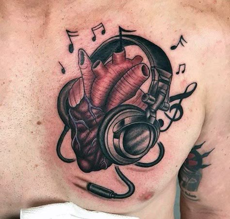 Masculine Headphones Heart Tattoos For Men Upper Chest Masculine Music Tattoo, Heart With Headphones Tattoo, Heart And Music Tattoo, Dj Tattoo Ideas For Men, Trash Polka Chest Tattoo, Music Note Tattoo For Men, Headphones Tattoo Design, Music Tattoo Designs Men, Music Tattoos Men