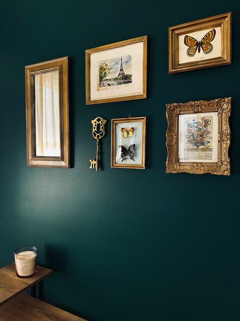 Emerald Green Gallery Wall, Gallery Wall Brass Frames, Dark Green Wall Gold Frames, Gold Frames On Green Wall, Brass Picture Frames Gallery Wall, Eclectic Picture Frame Wall, Gallery Wall On Dark Green Wall, Green And Gold Vintage Bedroom, Gold Photo Frames Wall