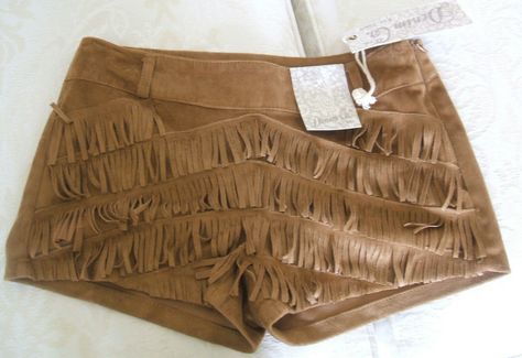 SEE NOTES BELOW REGARDING SIZING WOW!!! - GORGEOUS OR WHAT!!!! - THESE LOOK FAB ON!!! -  BRAND NEW with tags THESE FABULOUS TAN, BLACK OR BROWN FAUX SUEDE TASSEL SHORTS/HOTPANTS I may also have another pair in tan size 10 available upon request which have a flaw.  Please enquire if interested in that pair  CHOICE OF SIZES AS AVAILABLE ABOVE (please be aware - I have tested these for size and on me they appear to be a tad small for size. I cannot guarantee a fit - I can only tell you how they fit me but if you let me know the size and colour you are interested in I will happily give you the waist measurements upon request should you need them STYLISH AND RIGHT ON TREND AND A REALLY LOVELY SHAPE ON HAND WASHABLE   NOTE: Please be aware the zips on some of the pairs are a little stiff ZIP FAS Fringe Leather Shorts, Tan Clothes, Thrift Inspiration, Shorts With Fringe, Fringe Shorts, Inspo Fits, Tassel Shorts, Gladiator Shoes, Suede Shorts