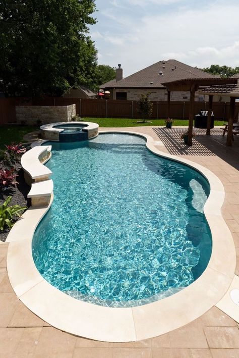 QuartzScapes Regular Series Mariner Blue | NPT Pool Finishes Free Form Pool With Hot Tub, Circle Pool Ideas, Free Form Pools With Spa, Houses With Pools In The Backyard, Small Inground Pool With Hot Tub, Water Features For Pools, Backyard Pool Inspiration, Small Fiberglass Pool Ideas, Pool On Side Of House