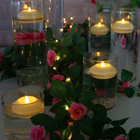 Floating tea lights Floating Tea Lights, Led Floating Candles, Floating Led Candles, Swan Photography, Three Roses, Vase Centerpiece, Round Candles, Gallery Lighting, Floating Lights