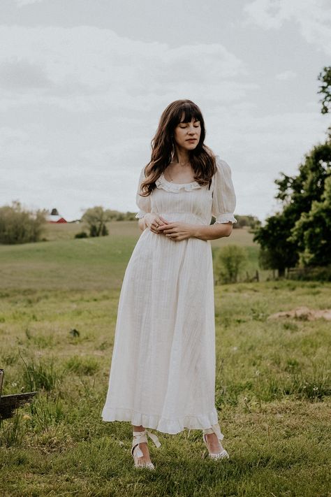 A roundup of my Christy Dawn Dress collection. The best dresses to buy from this ethical fashion brand. Bridgerton Inspired summer dress from Christy Dawn on woman in field