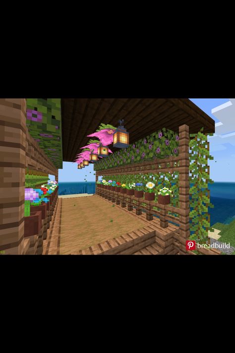 This Minecraft bridge is made of wood and lots of plants. This is after the Minecraft 1.17 Cave Update, Glow Berry and Spore Blossom were added. This closer view shows the plants inside the bridge. Spore Blossom In Minecraft, Minecraft Spore Blossom, Cherry Blossom Bridge Minecraft, Garden Minecraft, Minecraft Bridge, Mc House, Lots Of Plants, Berry Garden, Small Bridge