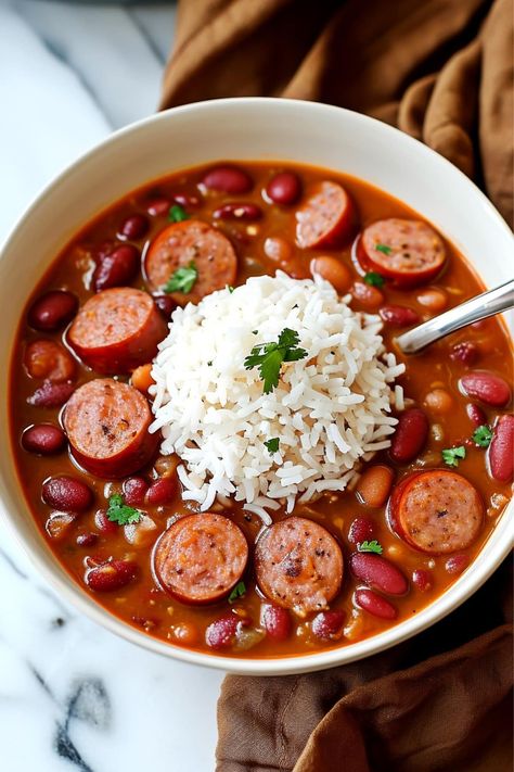 Get a taste of Louisiana with this red beans and rice recipe! Learn how to make it, plus, get tips for leveling up the dish and storing your leftovers. Chili Beans And Rice, Louisiana Dinner Recipes, Rice And Beans Recipe Easy, Quick Red Beans And Rice, Red Beans And Rice Crockpot, Beans And Rice Crockpot, Red Beans And Rice Soup, Rice And Bean Soup, Cajun Red Beans And Rice Recipe