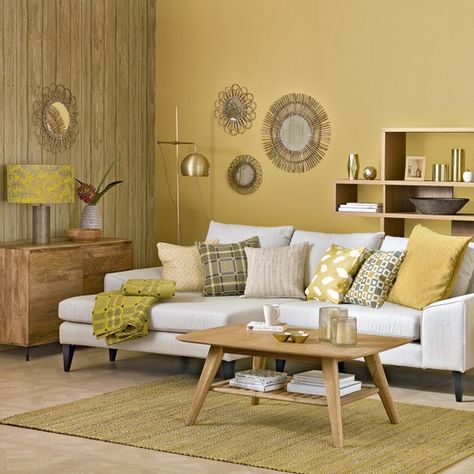 This honeycomb yellow living room with sunburst shades is a warm and vibrant space. Pair yellow hues with neutral tones to retain balance Yellow Living Room Colors, Living Room Colour Design, Popular Living Room Colors, Mustard Living Rooms, Yellow Walls Living Room, Living Room Colour Schemes, Living Room Color Combination, Bold Living Room, Room Color Combination