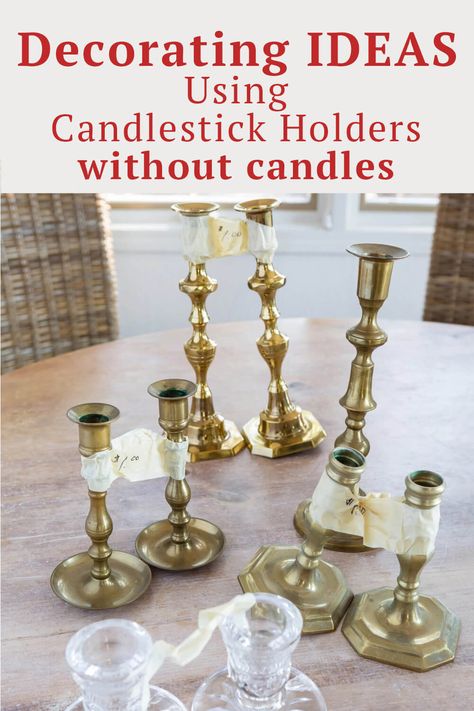 How to use candlesticks without candles when home decorating. Many easy and doable ideas using the candle holders you already own in new and creative ways. Decorating With Candelabras, Candle Stick Christmas Decor Ideas, Gold Candle Sticks Decor, What To Do With Candle Holders, Styling Brass Candlesticks, Candlestick Topper Ideas, Upcycle Candle Stick Holders, Old Candelabra Ideas, Coffee Table Decor Candle Sticks