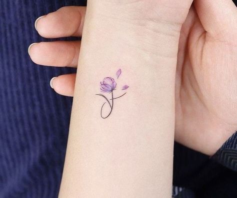 #tattoo, #tattoos, #inked, #tattooart, #tattooedwomen, #tattooedguys, #tattooinspiration, #tattooideas, #tattooworldwide, #tattoosociety, #InkLaughs, and #TattooFails​ Color Flowers Tattoo, Small Violet Flower Tattoo, Unforgettable Tattoo, Fine Tattoo, Classy Tattoos For Women, Violet Tattoo, Magic Runes, Flower Wrist Tattoos, Wrist Tattoos For Guys