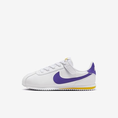 How do you make a classic like the Cortez even better? Make it quick and easy to put on, of course. The top lace loop is attached to a hook-and-loop strap so kids can slip these on and secure the fit fast—no tying of laces required! Plus, extra wiggle room in the toe box helps give little feet the space they need as they run, jump and play. Nike Classic Cortez Outfit, Nike Classic Cortez, Classic Cortez, Nike Classic, Nike Cortez, Shoes White, Lace Tops, Womens Shoes Sneakers, Kids Shoes