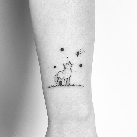 Little Wolf tattoo by Mimi Mine #MimiMine #fineline #linework #dotwork #small #minimal #wolf #dog #coyote #fox #animal #nature #stars #galaxy #tattoooftheday Cute Wolf Tattoo, Simple Wolf Tattoo, Coyote Tattoo, Wolf Tattoos For Women, Small Wolf Tattoo, Minimal Nature, Cute Wolf, Stars Tattoo, Fox Animal