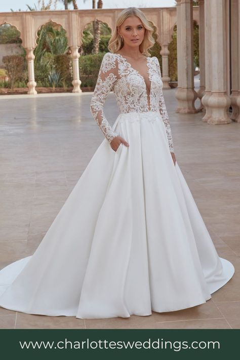 An elegant long sleeve ball gown wedding dress from Sincerity Bridal. This style features a classic mikado skirt with pockets! Charlotte's is the best wedding dress shop in Portland, Oregon with the largest selection of wedding dresses in PDX. Find plus size, a line, fit and flare, beaded wedding dresses and so much more! Shop bridal accessories, veils, jewelry and bridal merch! Long Sleeve Wedding Gown, Corset Plus Size, Beaded Corset, Sincerity Bridal, Long Bridal Gown, Girls Bridesmaid Dresses, Long Sleeve Wedding Gowns, Wedding Gowns With Sleeves, Bridal Elegance