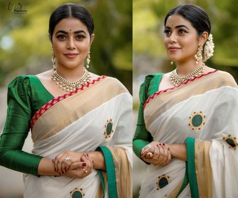 For an event, Poorna wore a traditional white Kerala saree that featured embroidered green motifs paired with a green three-quarter puff sleeves blouse by Vasah. Jewelry from Kushal's Fashion Jewellery, green bindi and a center-parted gajra bun complemented her look! Three Forth Sleeve Saree Blouse, Three Quarter Sleeve Blouses For Saree, Kerala Cotton Saree Blouse, Onam Saree Blouse Ideas Full Sleeve, Quarter Sleeve Blouse Design, Kerala Saree Blouse Designs Puff, Puff Sleeve Blouse Indian Lehenga, Puff Full Sleeve Blouse Indian, Full Puff Sleeves Blouse