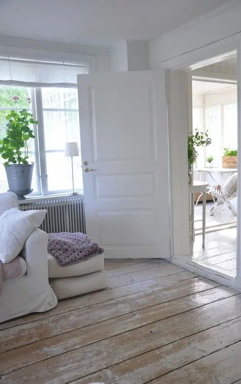 a Scandinavian space with wooden whitewashed shabby floors that give a nonchalat touch to the space White Painted Wood Floors, White Hardwood Floors, Bedroom Wooden Floor, Distressed Wood Floors, White Wooden Floor, White Washed Floors, Carpet Diy, Wood Plank Ceiling, Reclaimed Wood Floors