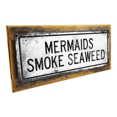 Our Retro Mermaids Smoke Seaweed metal sign is affordable art for your tropical decors, surf shack, beach cottage, vacation rental, or tiki bar. This white wall plaque has black accents and was designed in the industrial style. The metal sign is made from 24-gauge steel, and is mounted on a sturdy, hand-made frame with weathered screws to complete the rustic look. | Trinx Framed, Outdoor Retro Mermaids Smoke Seaweed Metal Sign, Wall Art For Tropical Decor, Surf Decor, Beach Cottage, Vacation Ren Surf Cottage Decor, Boho Tiki Decor, Rustic Surf Decor, Mid Century Tiki Decor, Rustic Beach Bathroom Ideas, Tiki Signs Diy, Moody Beach Decor, Gothic Beach Decor, Southern Room Decor Country Bedrooms