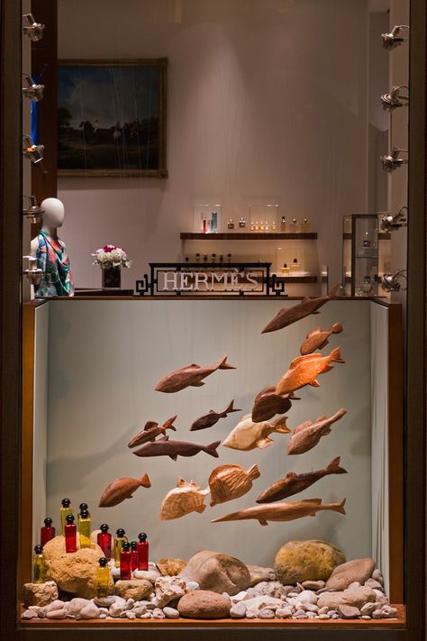 16 wooden fishes for Studio Astolfi, featured in the Hermès spring/summer Chiado, Lisboa, show windows.Photograph- Ricardo Cruz. Hermes Window, Fashion Window Display, Store Window Display, Visual Merchandising Displays, Store Window Displays, Window Display Design, Retail Windows, Store Windows, Exhibition Display