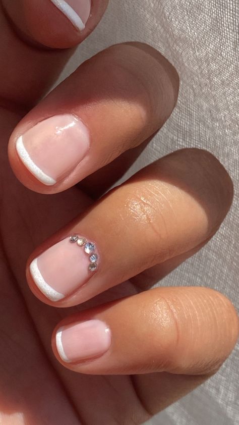 Trending French Tip Nails Short, Short French Manicure With Rhinestones, French On Natural Short Nails, White French Nails Ideas Short, Very Short Natural Nails Ideas, Short French Tip Acrylic Nails With Accent Nail, Very Short Squoval Nails, French Tip Gel Nails With Rhinestone, Gel Nails On Short Bitten Nails