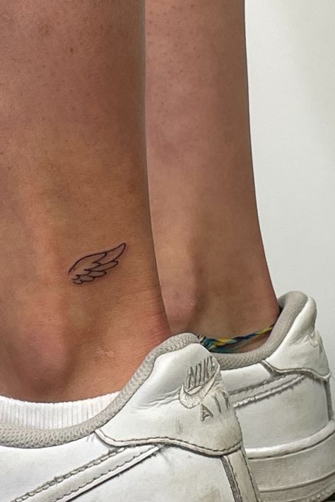 Wings Tiny Tattoo, Angel Wings Ankle Tattoo, Wing Tattoo On Ankle, Tiny Angel Wing Tattoo, Thumbs Up Tattoo, Simple Wing Tattoo, Angel Wing Ankle Tattoo, Simple First Tattoos, Angel Number Tattoo Placement