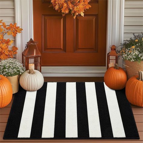 PRICES MAY VARY. CLASSIC PATTERN DESIGN: Black and white stripes are always timeless. TIMO door mat look incredible in a front porch or entryway thanks to the dramatic contrast between the two starkly different colors. Black and white stripes is a classic pick for fall and beyond. While the high-contrast checks complement orange pumpkins and autumnal farmhouse decor, they can also transition easily into rustic Christmas decorations. Perfect for front door decorations NON-SLIP TPR BACKING: This i