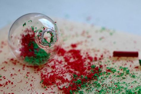 We had an absolute blast making these melted crayon Christmas ornaments! Its just shavings from old crayons inside a clear fillable round ornament. Add a little blast from the hair dryer and its a lovely bright and cheery tree ornament! We did a red and green combo, primary colours, favorite colors, unicorn colors.... et cetera. Your imagination is the limit BEFORE: Here are the old crayons we used and the clear fillable ornaments. STEP 1: Use a kitchen grater to create crayon sh… Crayon Ornaments, Kids Christmas Craft, Christmas Yarn Wreaths, Clear Plastic Ornaments, Beads Candy, Easy Christmas Wreaths, Primary Colours, Unique Christmas Ornaments, Christmas Ornaments Diy