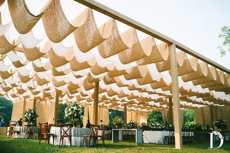 Weddings nowadays are moving towards a more subtle colour palette which is both pleasing to the eye and aesthetically stunning. This wedding decor is a perfect example of the new age of Indian wedding decor with a canopy so pretty giving us major rustic vibes. Pc: Devika Narain Company #indianwedding #wedding #haldi #haldidecor #decor #weddingdecor #intimatewedding #homedecorideas #homedecordiy Boho Theme Indian Wedding Decor, Devika Narain Indian Weddings, Indian Rustic Wedding, Indian Wedding Outdoor Decor, Indian Marquee Decor, Sustainable Indian Wedding Decor, Devika Narain Decor, Wedding Decor Boho Rustic, Boho Theme Haldi Decor