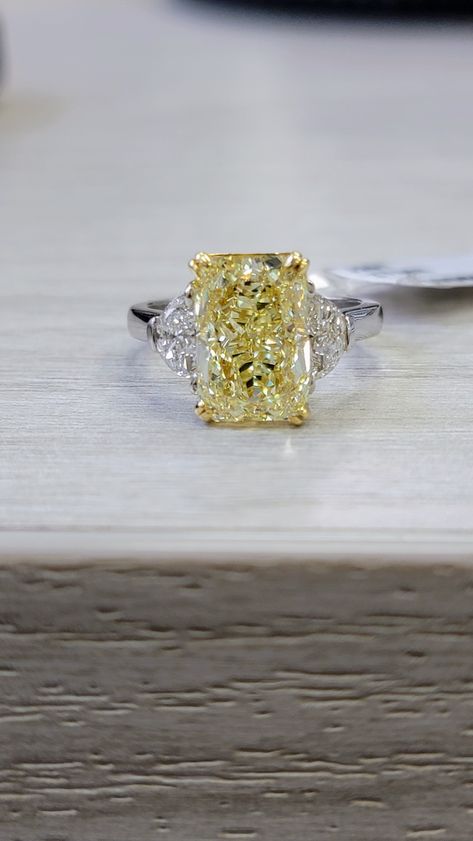 Extremely elongated and gorgeous 5ct Fancy Light Yellow Radiant with an impressive 1.43 ratio Strong color like a Fancy Yellow VVS clarity Set in Platinum and 18kt Yellow Gold with 0.62ct of D VS Half Moons Yellow Canary Diamond Ring, Yellow Engagement Ring, Fancy Yellow Engagement Ring, Canary Diamond Ring, Fancy Yellow Diamond Ring, Yellow Diamonds Engagement, Yellow Diamond Engagement Ring, Canary Diamond, Half Moons