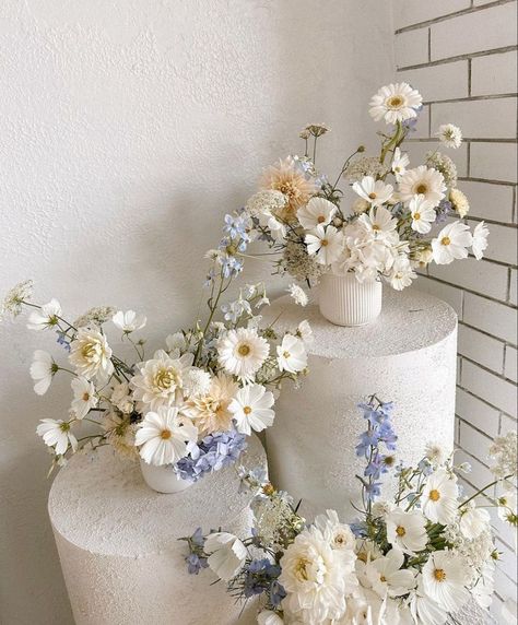 Sep 10, 2023 - This Pin was discovered by Leasie Bettiol. Discover (and save!) your own Pins on Pinterest Coastal Grandma Wedding Flowers, Civil Wedding Flowers, Blue Artificial Flower Arrangements, Tent Wedding Flowers, Summer Blue Wedding Colors, High Low Centerpieces Weddings, Minimal Modern Wedding Dress, White Flowers Aesthetic Wedding, 2024 Wedding Table Trends