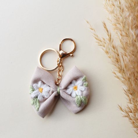 Embroidery Products Unique, Embroidered Keychains, Keychain Embroidery, Embroidery Jewellery, Embroidery Keychain, Embroidered Accessories, Fabric Keychain, Winter Caps, Diy Makeup Bag