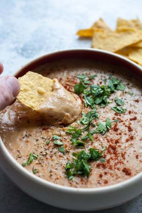 Cheesy Pinto Bean Dip - ready in no time and is perfect for game day. Also great as a nacho topper! macheesmo.com #pintobeans #dips #appetizers #easyrecipes Instant Pot Bean Dip, Pinto Bean Dip Recipes, Pinto Bean Hummus Recipe, Pinto Bean Dip, Dips Appetizers, Bean Nachos, Pinto Bean Recipes, Pinto Bean, Cooking Dried Beans