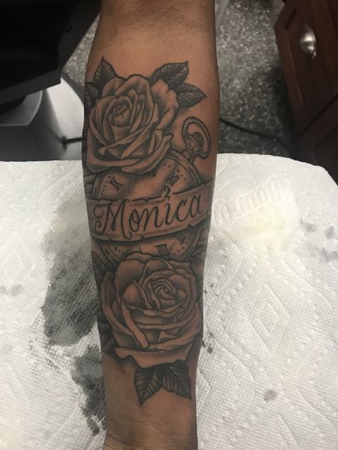 Rose Clock Ribbon Name tattoo for MOM Tattoo With Roses And Name, Forearm Tattoo Moms Name, Name Half Sleeve Tattoo, Forearm Tattoo With Roses, Name Tattoo With Roses Forearm, Momma Name Tattoo Ideas, Tattoo Ideas Mom Name, Mom Rose Tattoo For Men, Forearm Mom Tattoo